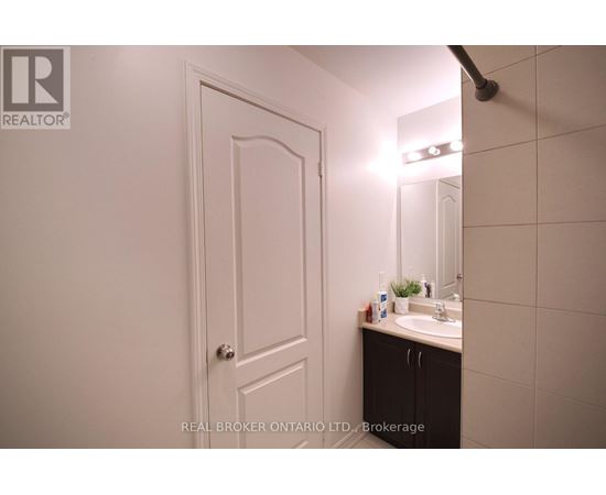 A bathroom with a sink and mirror.