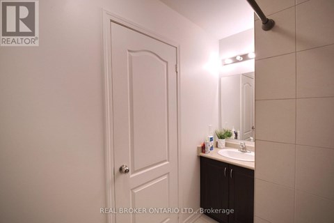 A bathroom with a sink and mirror.