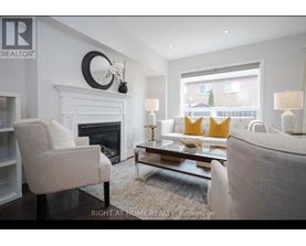 A living room with a fireplace and a couch.