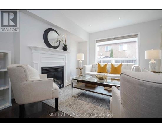 A living room with a fireplace and a couch.