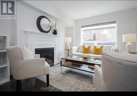 A living room with a fireplace and a couch.