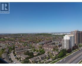 A view of a residential area with apartment buildings and houses.