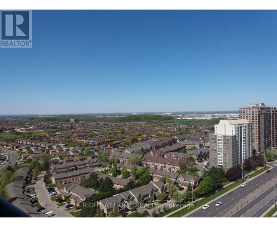 A view of a residential area with apartment buildings and houses.
