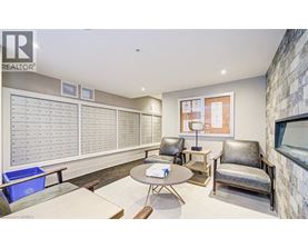 A realtor's office with a whiteboard and a table.