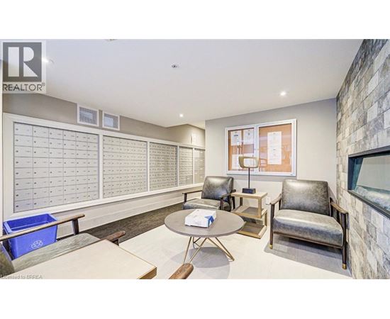 A realtor's office with a whiteboard and a table.