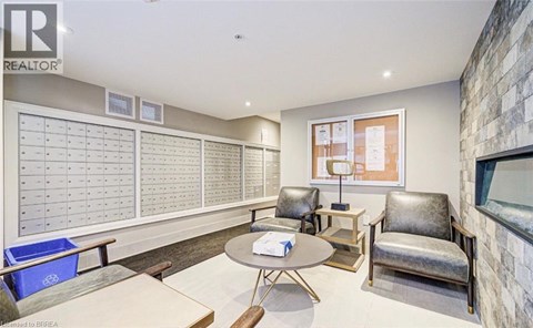 A realtor's office with a whiteboard and a table.