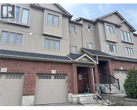 A two-story residential building with a garage on the ground floor.