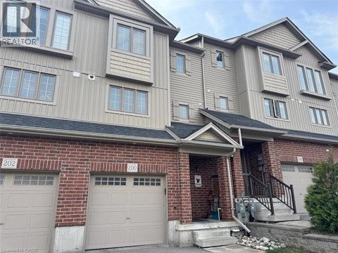 A two-story residential building with a garage on the ground floor.