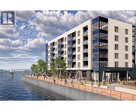 A modern building with a glass facade is situated by a body of water.