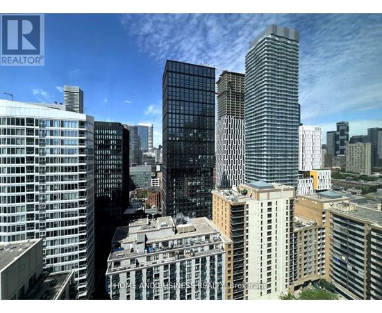 A cityscape with skyscrapers and a building with a sign that says "HOME AND BUSINESS".