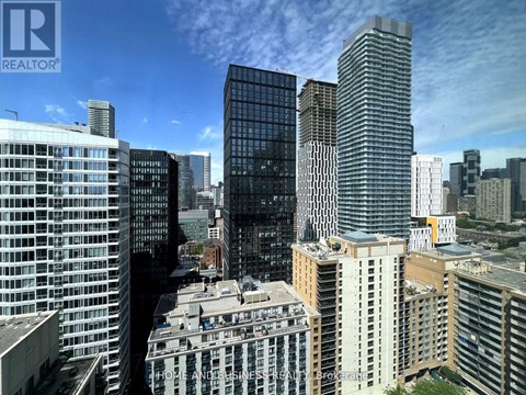 A cityscape with skyscrapers and a building with a sign that says "HOME AND BUSINESS".