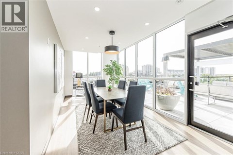 A modern dining room with a table set for four.