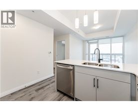 A modern kitchen with a sink and cabinets.