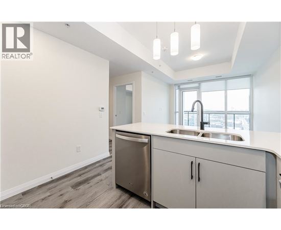 A modern kitchen with a sink and cabinets.