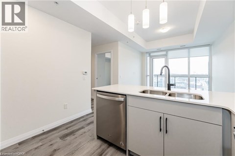 A modern kitchen with a sink and cabinets.