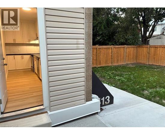 A realtor sign is on the front door of a house.
