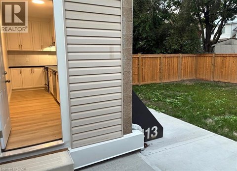 A realtor sign is on the front door of a house.