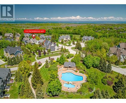 An aerial view of a neighborhood with a pool and a red marker indicating the location of 159 Snowbridge Way.