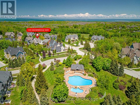 An aerial view of a neighborhood with a pool and a red marker indicating the location of 159 Snowbridge Way.