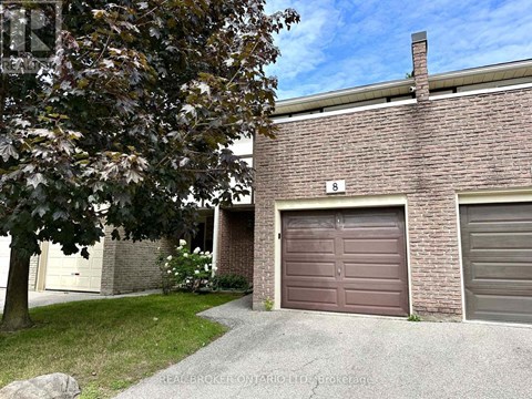A house with a brown garage door is for sale.