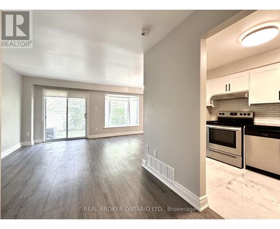 A kitchen with a stove top oven and a microwave.
