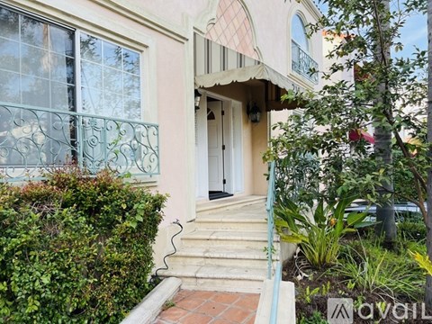 A house with a white door and a small porch.