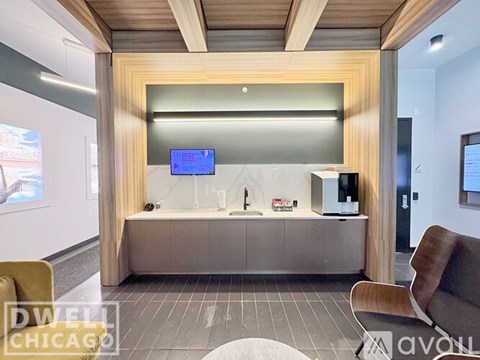 A modern living room with a wooden accent wall and a flat screen TV mounted on the wall.