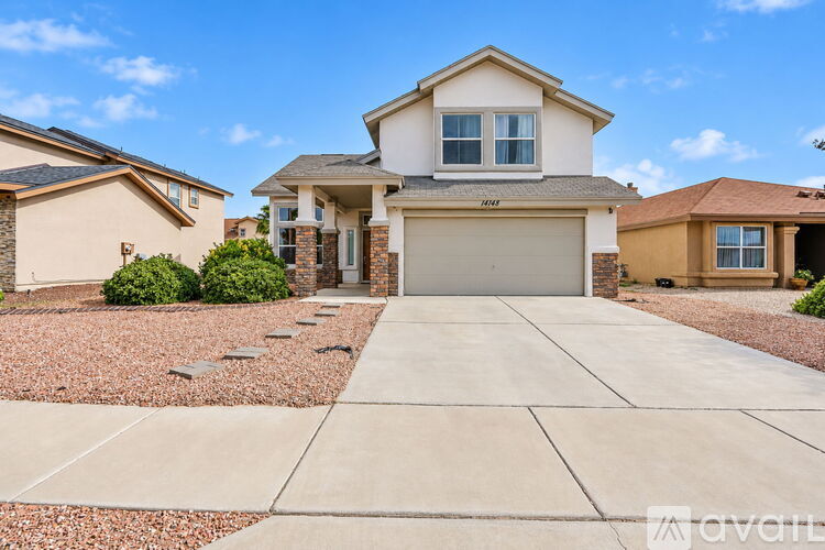A house with a driveway in front of it.