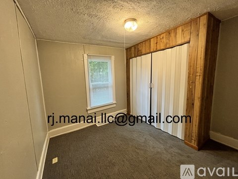 A room with a window and a sliding door.
