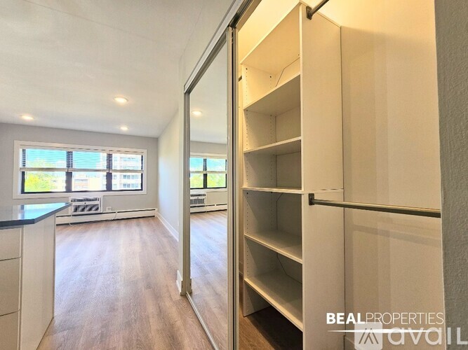 A BEALPROPERTIES photo of a kitchen with a pantry.