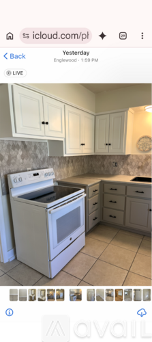 A white oven and microwave in a kitchen.
