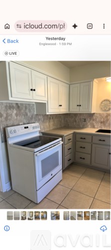 A white oven and microwave in a kitchen.