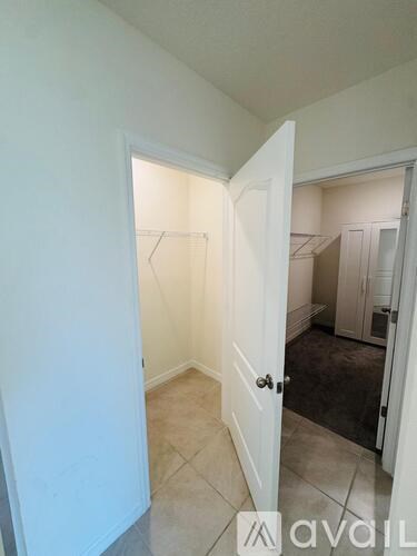 A room with a doorway leading to another room.