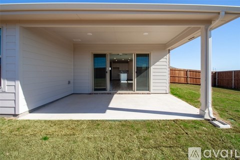A modern house with a white exterior and a covered patio area.