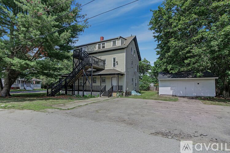 A house with a tree in front of it.