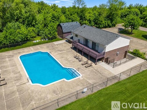 A house with a pool in the backyard.