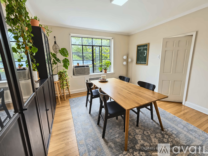 A kitchen with a table and chairs in the middle of the room.