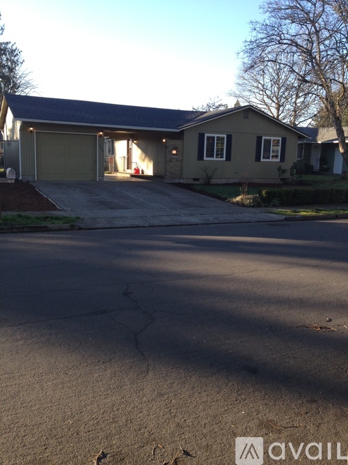 A house with a driveway in front of it.