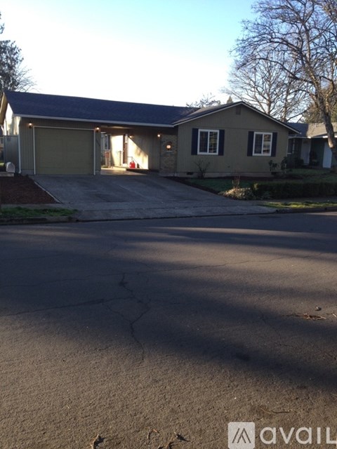 A house with a driveway in front of it.