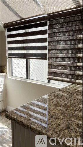 A kitchen counter with a striped pattern on it.