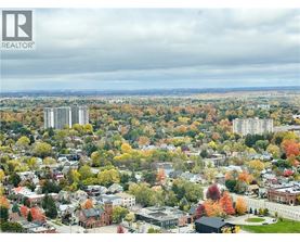 A cityscape with a mix of residential and commercial buildings.