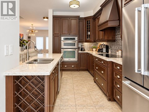 A kitchen with brown cabinets and a white counter top.