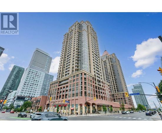A tall building with a sign that says "Royal" on it.