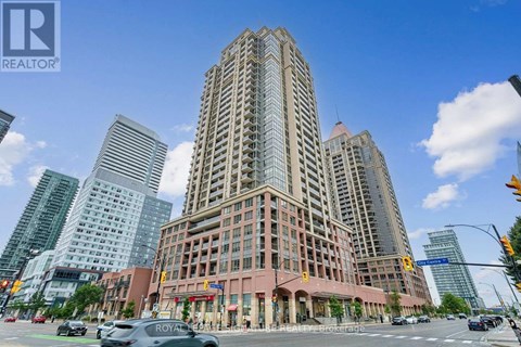 A tall building with a sign that says "Royal" on it.