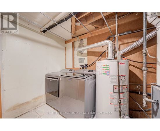 A wall-mounted water heater and a tankless water heater are installed in a basement.