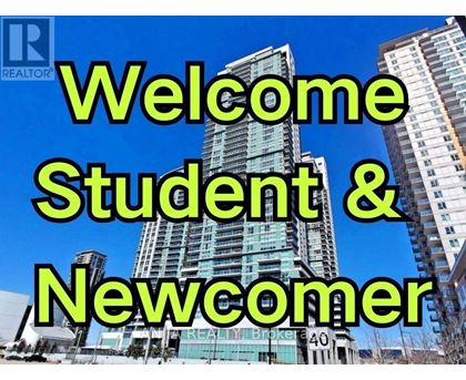 A realtor logo with the text "Welcome Student & Newcomer" in front of a cityscape.