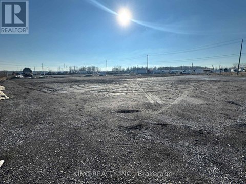 A parking lot with a sunny sky above it.