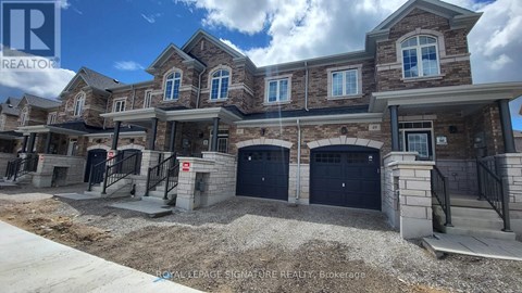 A row of new houses with garages in front.
