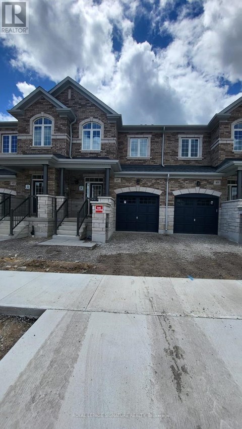 A large house with a garage is under construction.