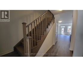 A staircase with a wooden banister and steps.